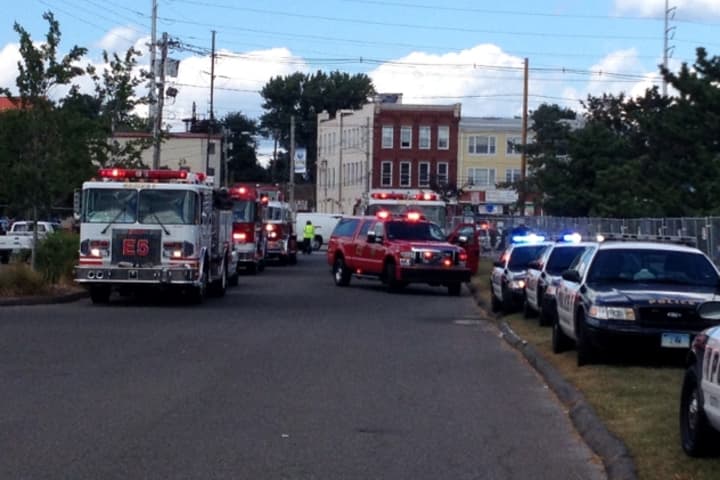 Norwalk Police and Fire crews respond to a ride malfunction that sent 15 people to local hospitals at the Oyster Festival on Sunday.