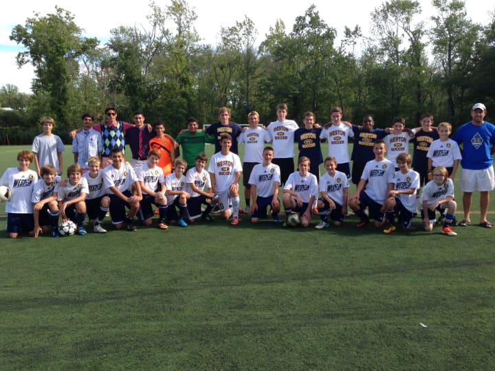 Members of the Weston youth soccer league and the Weston High School Soccer team played a memorial game Saturday in honor of their friend AJ Cina, who died in July.