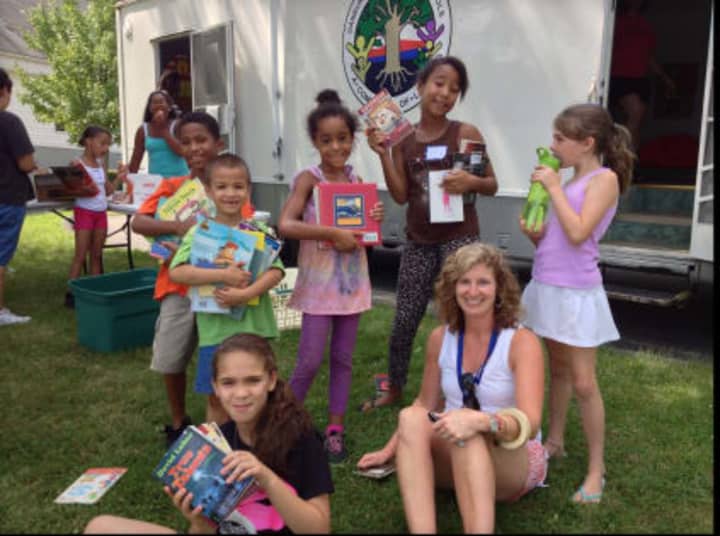 Danbury elementary teacher Bonnie Caton opened up the &quot;Literacy Mobile&quot; over the summer to help kids read during the long break from school.