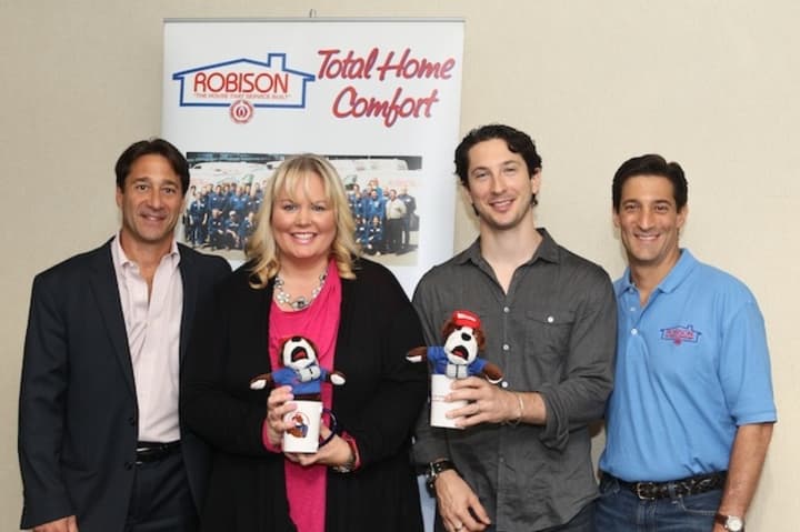 David Singer, co-President of Robison Oil, left, stands with  Dr. Kathy Reilly Fallon of Heavenly Productions Foundation, Jonny Hirsch and Daniel Singer, Co-President of Robison Oil.