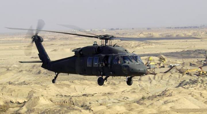 A Black Hawk helicopter flies a low-level mission over Iraq in January 2004. Black Hawk helicopters are assembled in Stratford.