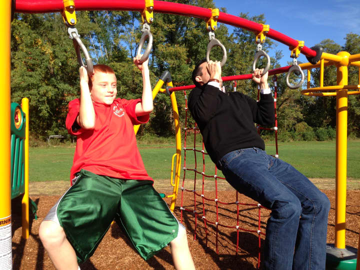 Senator Ball challenged a fifth grade student to a pull-up contest on the new equipment. 