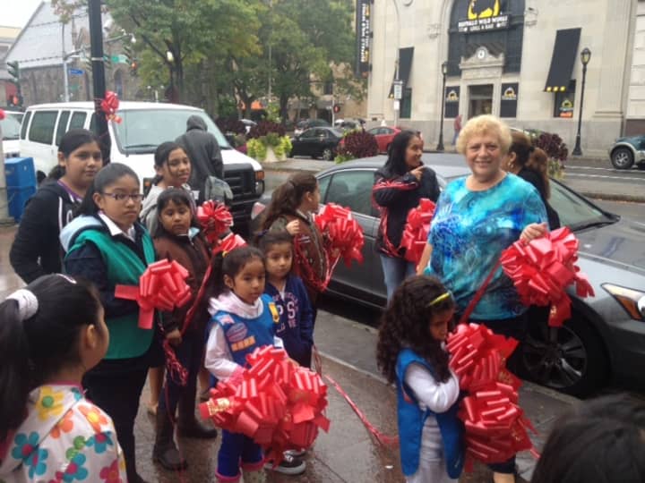 Girl scouts and volunteers put up red ribbons for Red Ribbon Month 2012. 