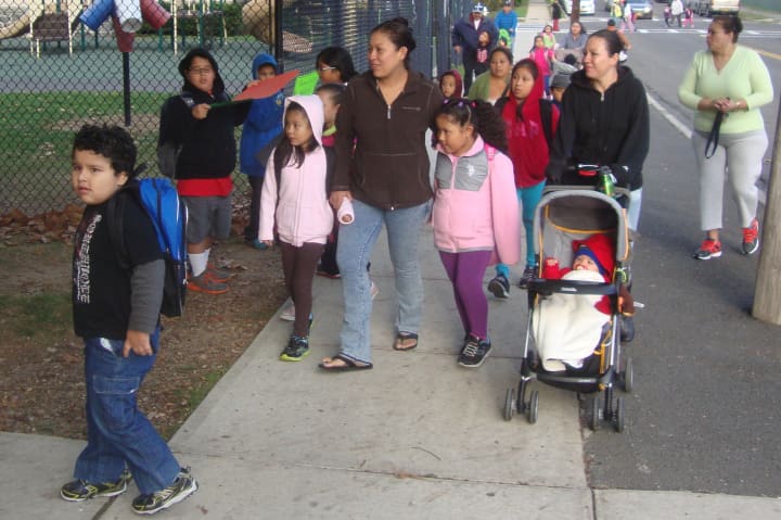 Crowds of students arrive at Thomas A. Edison School with their parents as the district celebrates International Walk to School Day.