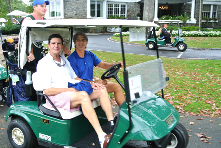 <p>Golfers like Bernie Curry (left) were able to make the Christopher D. Mello Golf fundraiser a success despite rainy conditions</p>