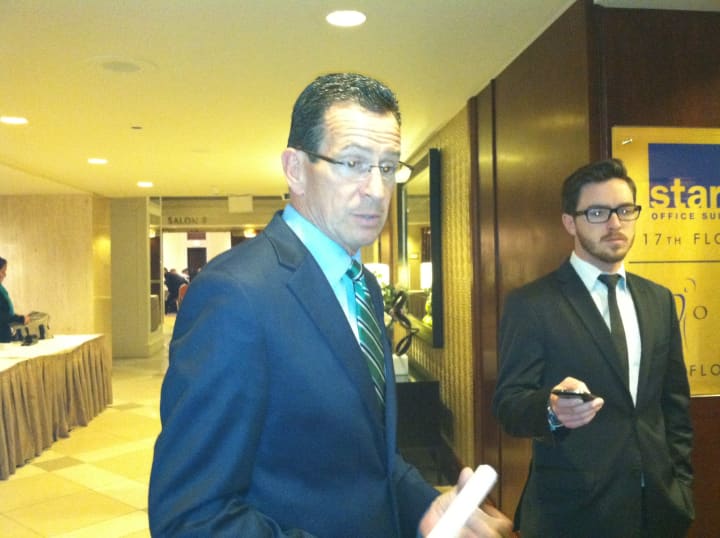 Gov. Dannel P. Malloy speaks briefly to the media after speaking at the Stamford Chamber of Commerce&#x27;s annual meeting Thursday.