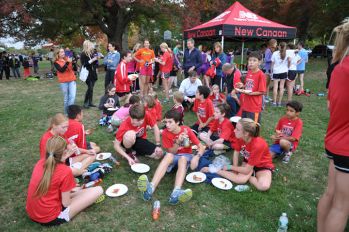 Runners from the New Canaan Running Club relax after Wednesday&#x27;s race.