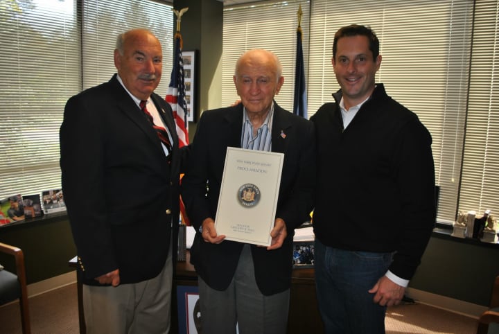 Sen. Greg Ball, right, recently honored Mount Kisco&#x27;s John Hvisch, center, with the induction into the Veterans&#x27; Hall of Fame. Mount Kisco Mayor Michael Cindrich, left, was on hand for the event.