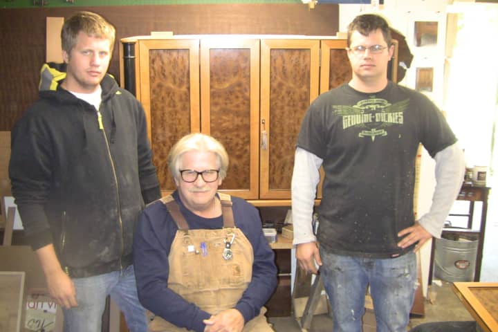 Willy Godziemba-Maliszewski, Master Cabinetmaker at London Joiners, works with his sons Harry, left, and Jamie.