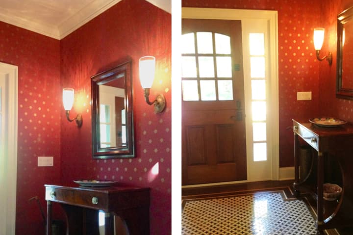 The entrance foyer was furnished simply with basket-weave floor tiles, period lighting sconces, a dark wood pier table and mirror to complement the dark wood entrance door.