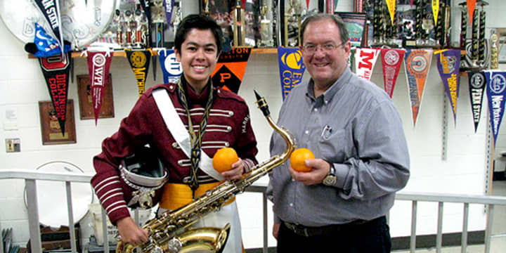 Harrison High School sophomore Philip Milana and Marching Band Director Charlie Briem.