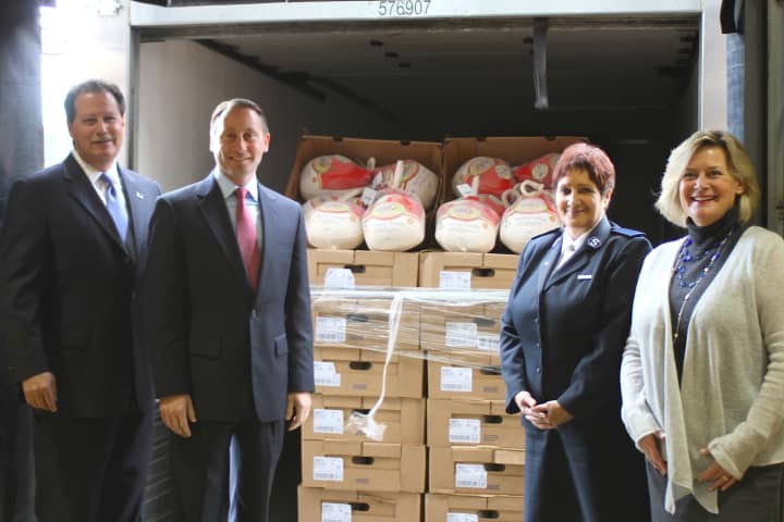 Rick Rakow, Food Bank for Westchester Board Chair; Westchester County Executive Rob Astorino; Captain Noel Rodriquez, Salvation Army Tarrytown Corps.; and Ellen Lynch, Executive Director of the Food Bank unload first batch of turkeys.