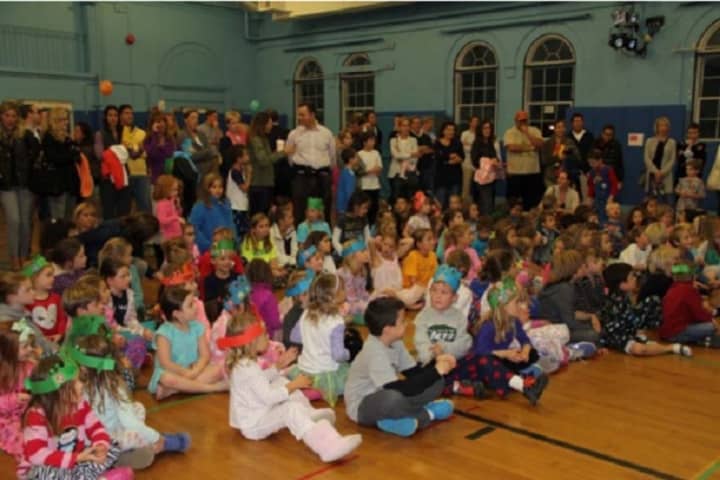 Students at Milton Elementary School recently gathered with family for reading night in Rye. 