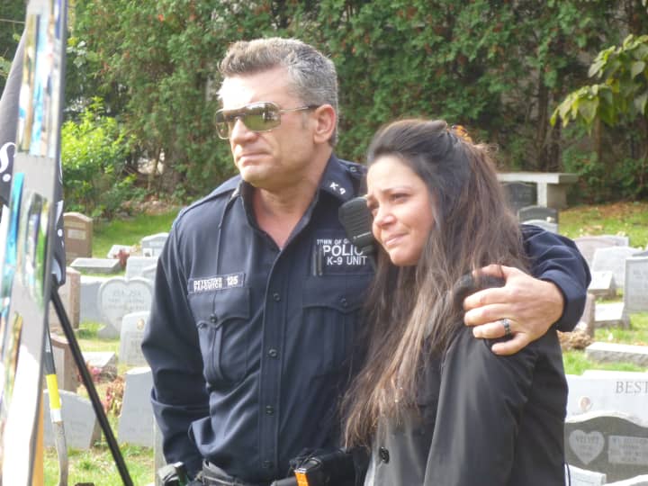 Greenburgh Police Det. Wayne Papovitch and wife Renata honored K-9 Officer Patriot at his funeral in Hartsdale.