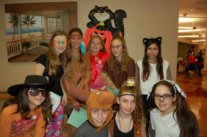 H.C. Crittenden students pose in their Halloween costumes while visiting St. Cabrini Nursing Home in Dobbs Ferry.