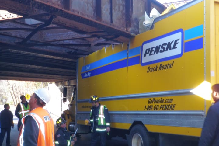 A Penske moving truck became stuck underneath the Saugatuck Avenue railroad bridge in Westport on Wednesday morning.