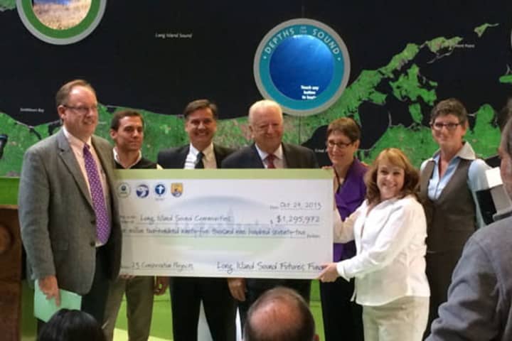 Officials present a check for cleanup projects in and along Long Island Sound.