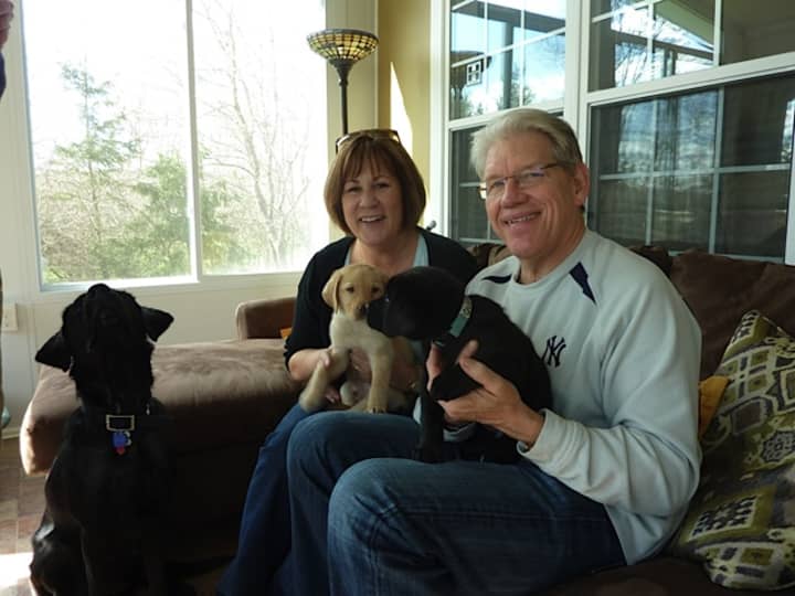 Dale and Gail Bergman with Nina and her pups, Quentin and Quarter