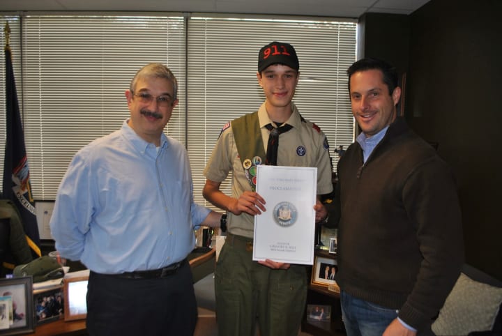 Yorktown resident Erik Santini, center, recently received a New York State Proclimation from Sen. Greg Ball for achieving the rank of Eagle Scout. 