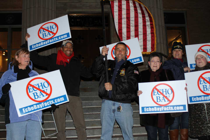 Members of United Citizens For A Better New Rochelle protested outside city hall.