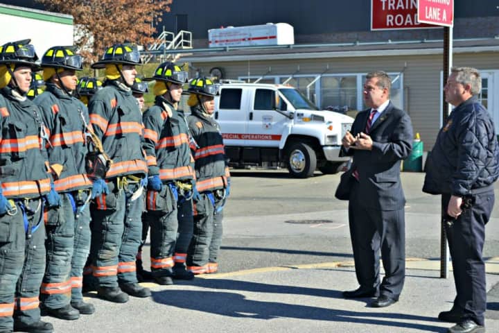 Mayor Mike Spano and Fire Commissioner Robert Sweeney speak to probationary firefighters before demonstration.