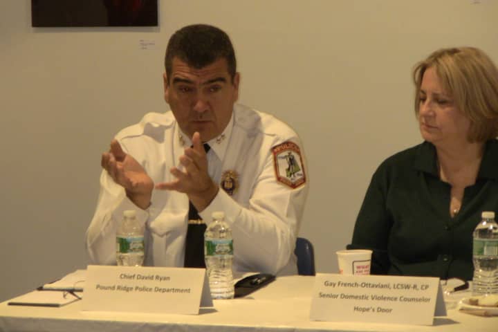 Pound Ridge Police Chief David Ryan, left, and Gay French-Ottaviani, senior counselor of Hope&#x27;s Door, discuss domestic violence.