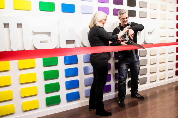 Jenny Lawton, president of MakerBot, assists CEO Bre Pettis, with the ribbon cutting ceremony at the new MakerBot Store in Greenwich.