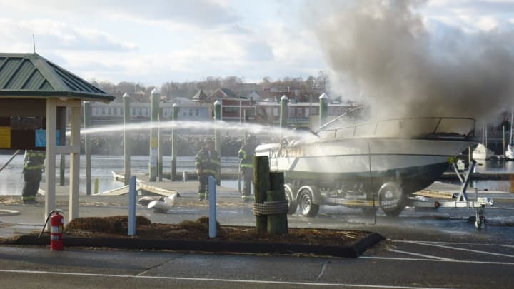 A boat caught fire Friday as it was pulled from the water on its trailer at the public boat launch in East Norwalk. 