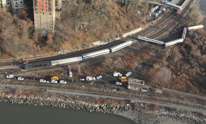 The Metro-North train engineer who fell asleep at the wheel, causing a derailment that killed four and injured 60 in the Bronx two years ago, was awarded a federal pension on Thursday.