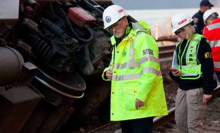 NTSB investigator Michael Flanigon inspects track at the scene of the Metro-North train derailment in the Bronx on Sunday. 