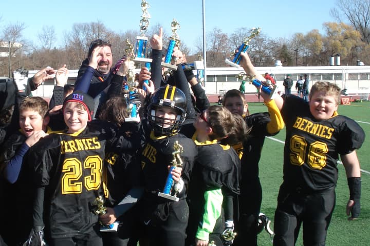 The White Plains Bernies celebrate their Westchester Youth Football League championship.