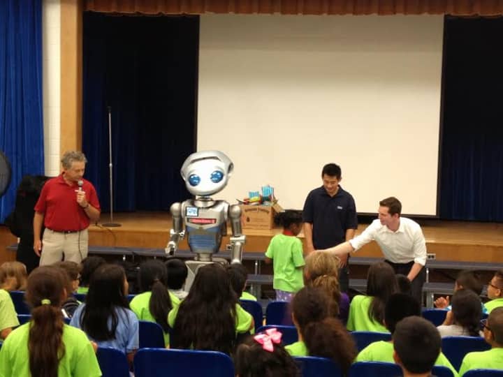 Students at the summer camp program come face to face with a robot.