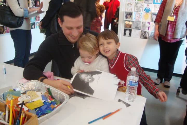 Chris Ryan, Eloise Toothman and Jack Ryan create photo collages at the Katonah Museum of Art&#x27;s Family Portrait Day.