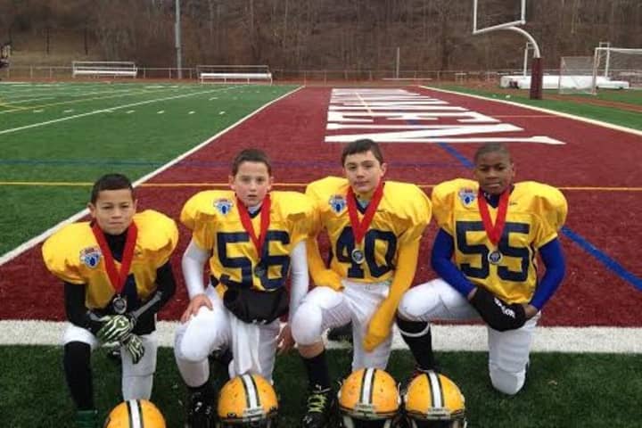Norwalk 6th grade football players (left to right) Kyle Gordon, Nick DiIorio, Jeffrey Cocchia, and Jermayne Daniels played on a Connecticut team in a regional tournament last weekend in New Jersey.