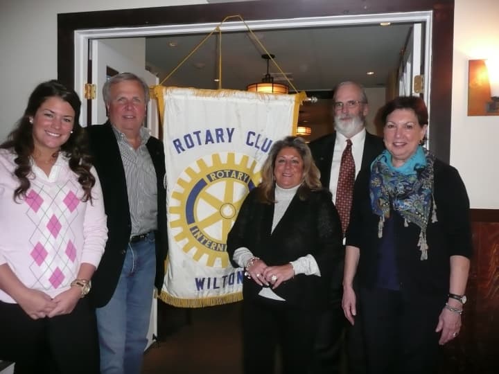 Pictured (from left) are Janeen Leppert, Rotarian Pat Russo who performed the induction, Rotarian Carol Johnson who sponsored both new members, Rotary President Paul Burnham, and Elizabeth Edwards. 
