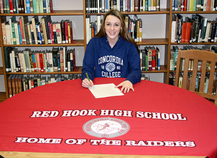 Julianne Wilkinson signing her letter of intent to go to Concordia.