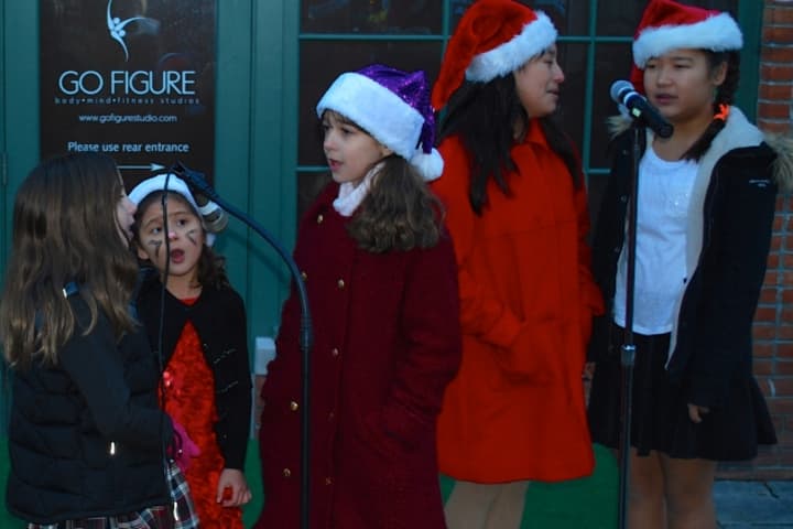 Anya Napoli, Darcy Gonzalez, Angelina Dalle Mule, Victoria Iparreguirre and Alexandra Bodnar at the Darien Arts Center&#x27;s Childrens Chorus performance at Grove Street Plaza on Saturday, Dec. 7. 