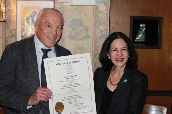 Pete Wolgast and state Rep. Gail Lavielle show off one of the many honors given to Wolgast at a recent luncheon. 