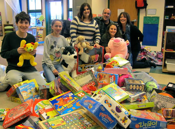 Volunteers at Westport&#x27;s Conservative Synagogue sort toys for the 19th annual Rebecca Chusid Toy Drive. 