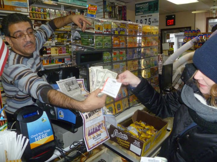 Jennifer Abel grabbed a $1 Mega Millions ticket at Mababa Deli in Hastings on Tuesday.
