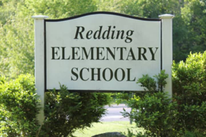 An office assistant at Redding Elementary School will be cut as part of the 2016-17 budget.