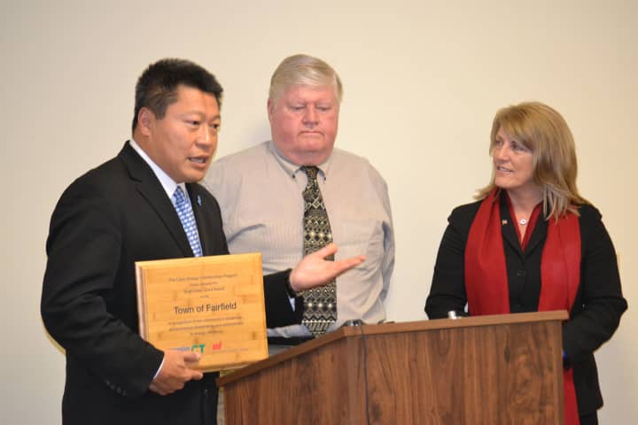 State Reps. Tony Hwang and Brenda Kupchick with Department of Public Works Assistant Director, Ed Boman who wrote the Bright Idea grant for the town at last weeks Board of Selectmens meeting.