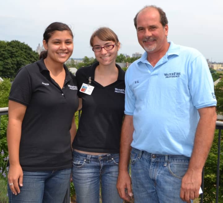 Chelsea Kryspin, center, poses with Jamie Leiva, Special Events assistant at WaterFire Providence ,left, and Paul Kochanek, director of Events &amp; Operations at WaterFire Providence.