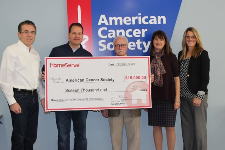 Members of the HomeServe team presented a check for $16,000 to the American Cancer Society. 