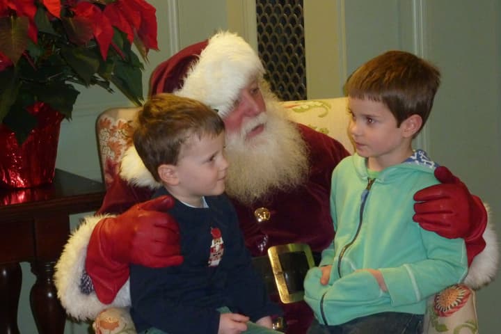 Santa Claus visits with children in Westport before Christmas.