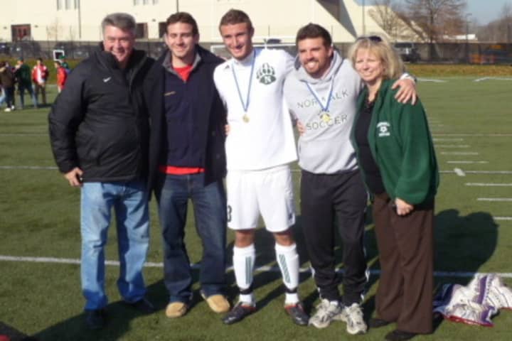 Dino Melitsanopoulos, left, stands with sons (left to right) Dean, Andrew and Paul and wife Martha after Norwalk HIgh won the state soccer championship in 2012.