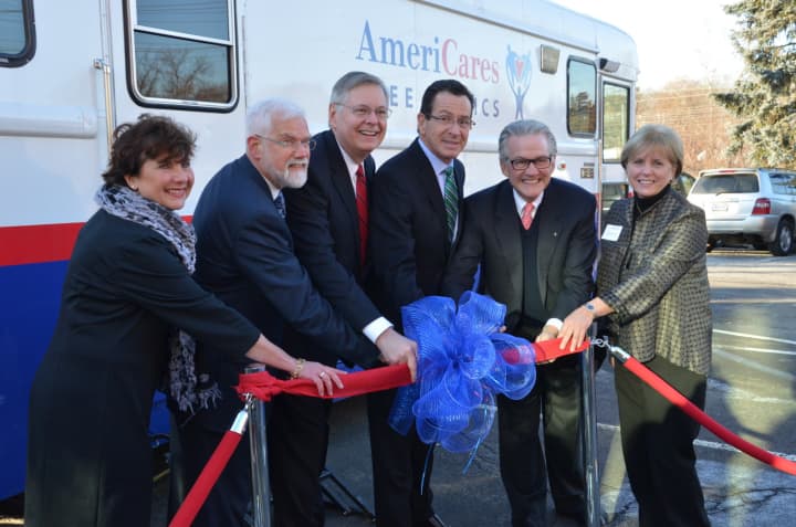 (Left to right) Stella Smith of Quest Diagnostics, David Smith of Stamford Hospital, Stamford Mayor David Martin, Governor Dannel Malloy,  Americares CEO Curt Welling and AmeriCares Free Clinics Executive Director Karen Gottlieb cut the ribbon.