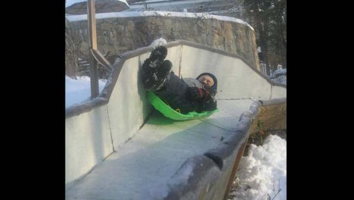 Tucker West glides on a luge run at his Ridgefield home as a youngster. The 18-year-old will represent the United States in the Winter Olympics next month in Sochi.