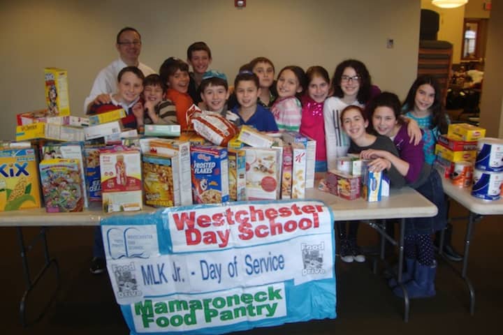Fifth grade students from Westchester Day School in Mamaroneck with all the food they collected as part of their Martin Luther King Jr. Day of Service