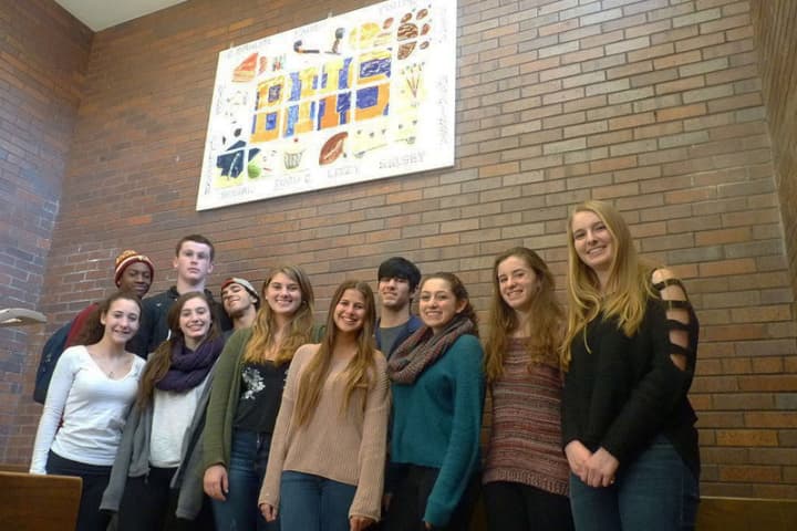Briarcliff High School art students show off their new mural.